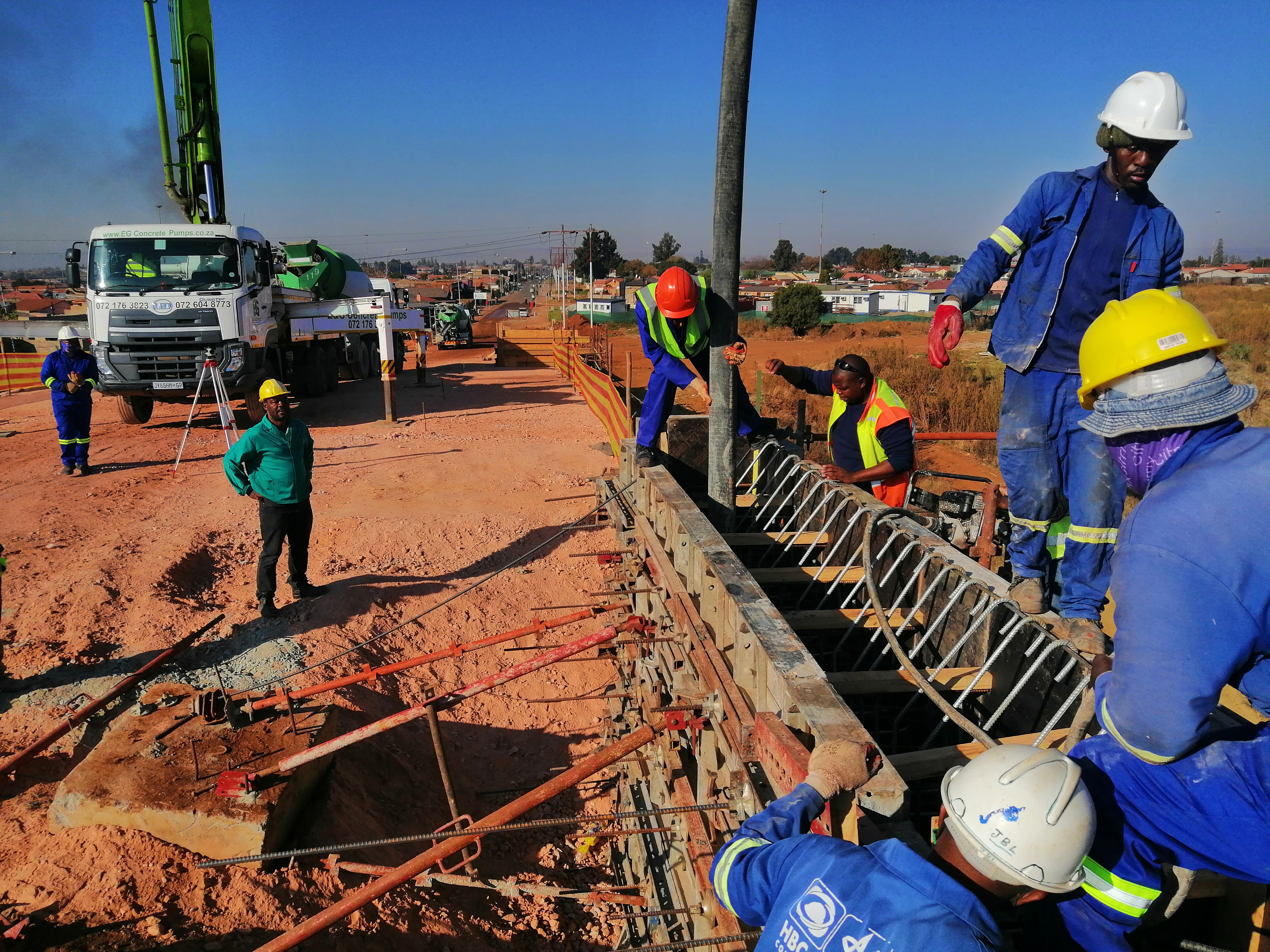 Figure 4: Fresh concrete mix being pumped to form the South abutment wall (A. Mahabeer, 2021)